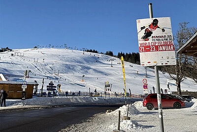 Picture of the snow-covered Feldberg. In the foreground, a poster for last year's event.